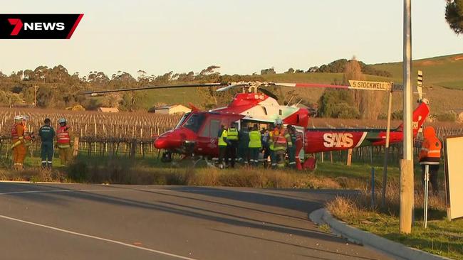 The driver being airlifted to hospital after his car collided with a school bus at Penrice in the Barossa Valley. Picture: 7NEWS