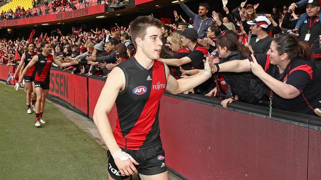 Zach Merrett thanks Essendon fans after the win over Gold Coast.