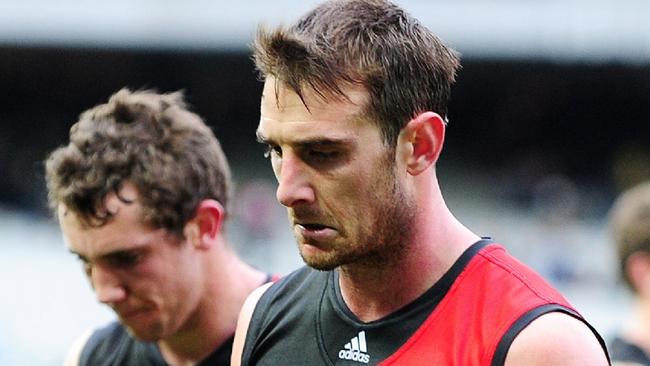 Jobe Watson leads Essendon off after a loss to Carlton in 2012. Picture: George Salpigtidis