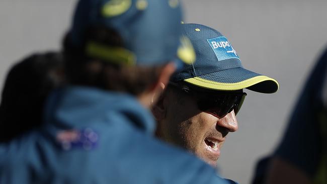 Australian coach Justin Langer speaks to his players during a net session at Old Trafford. Picture: Getty Images