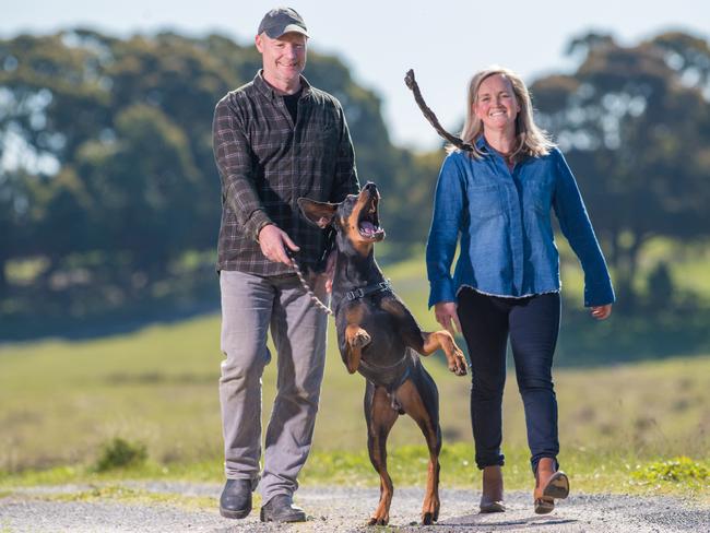 Brad Hoye and Cam Fithall with 11-month-old Doberman dog Ned. Picture: Jason Edwards