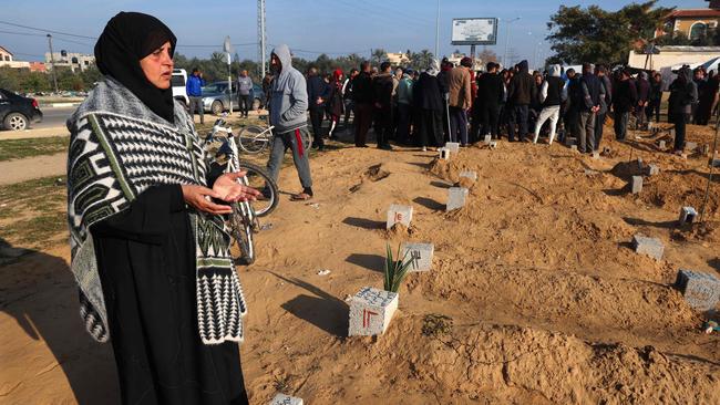 Palestinians bury their dead following overnight Israeli air strikes, at a cemetery in east Khan Yunis in the southern Gaza Strip on February 26, 2024. Picture: AFP