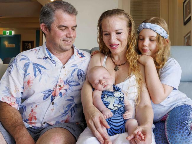 19th January 2023.Suvi Mahonen, baby Spencer, sister Amity, 9, and dad Luke Waldrip, at their Surfers Paradise unit.Photo: Glenn Hunt / The Australian