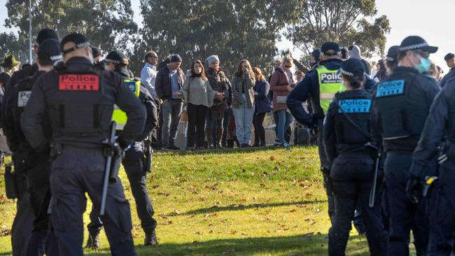 Police search for Pastor Paul Furlong of the Christian Revival Church after a potential anti-lockdown service at the church but was moved to the Max Pawsey Reserve at Narre Warren. Police surrounded a group and arrested two people. One was released after details were taken. Picture: Tony Gough