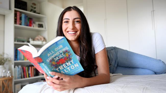 Avid book reader Faith Elhelou at home with her collection of books. Picture: Jeremy Piper