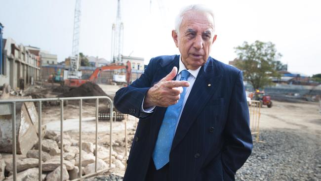 Harry Triguboff walking through his latest project in Parramatta, the Altitude.