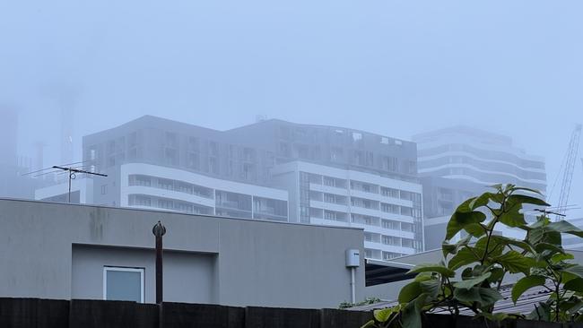 The haze spread to the city’s west on Monday, shrouding an apartment block in Footscray.