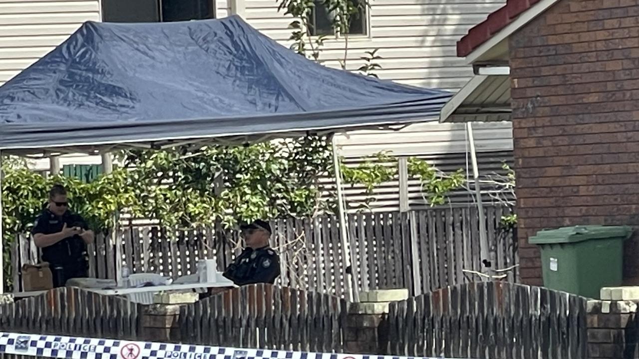 Police at the scene where a 24-year-old Mackay man was fatally shot following a routine wellness check. Photo: Mitchell Dyer