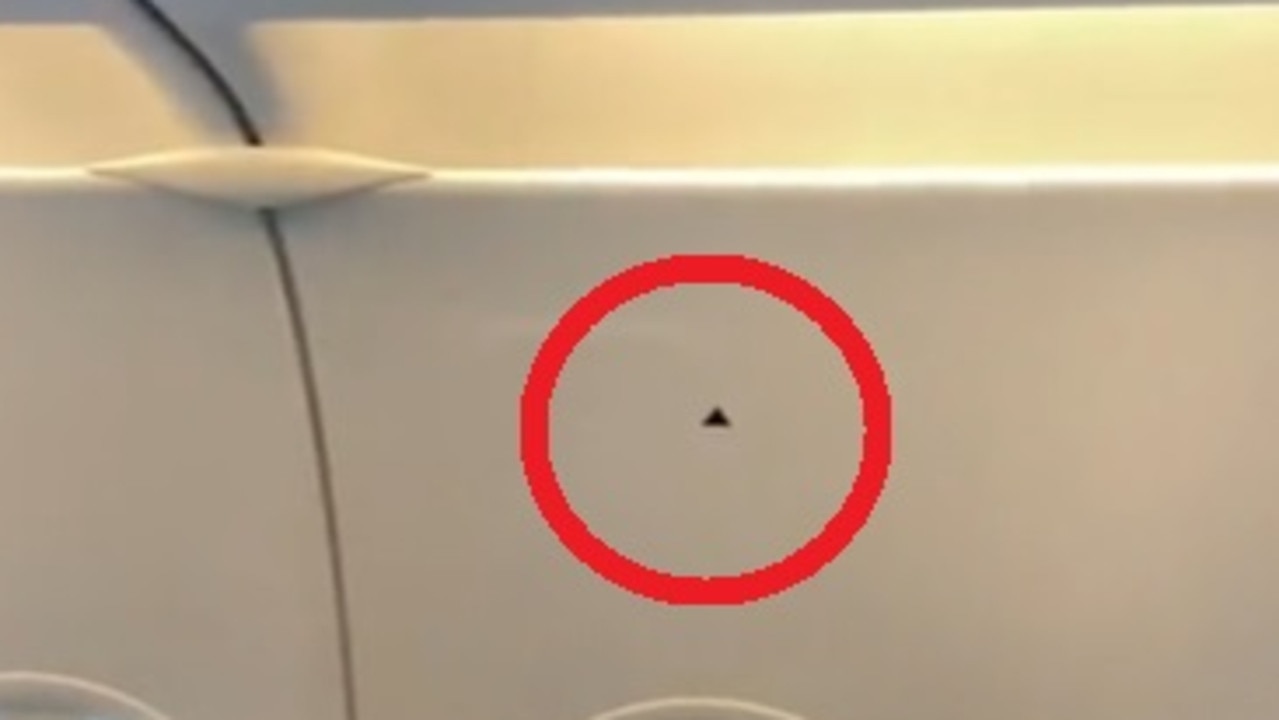 Truth on tiny detail above plane window