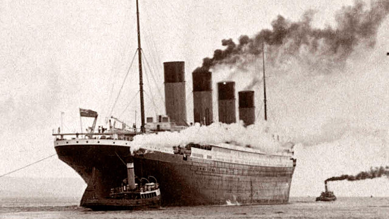Titanic leaving the docks, helped by tugboats