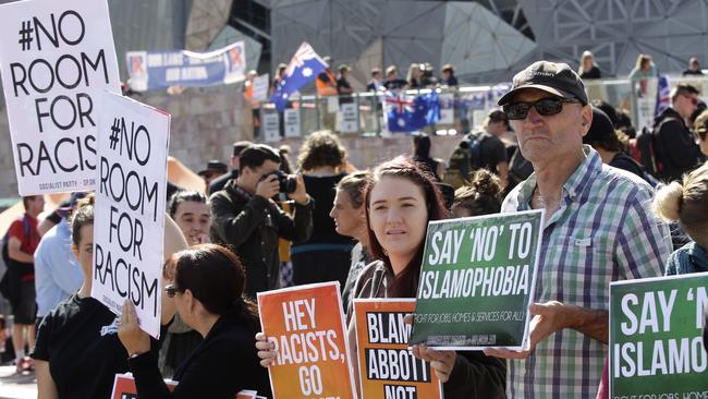 Protesters from Reclaim Australia behind Anti Racism proesters during a rally by anti racism protesters agaisnt the newly formed anti-Muslim group Reclaim Australia at Federation Square on Saturday, April 4, 2015, in Melbourne, Australia. Picture: Hamish Blair