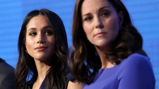 (FILES) In this file photo taken on February 28, 2018 (L-R) Britain's Prince Harry, Meghan Markle and Britain's Catherine, Duchess of Cambridge attend the first annual Royal Foundation Forum on February 28, 2018 in London. Meghan Markle once struggled for roles but the US actress has now landed the biggest part of all as she prepares to marry Prince Harry on May 19, 2018 and become the newest face in Britain's royal family. / AFP PHOTO / POOL / Chris Jackson