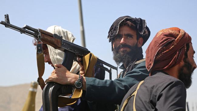 Taliban fighters stand guard in a vehicle along the roadside in Kabul. Picture: AFP