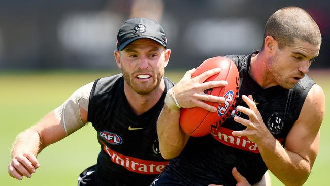 Tom Mitchell tackles Lachie Sullivan during a Collingwood Magpies AFL training session at AIA Centre on February 07. Picture: Photo by Josh Chadwick/Getty Images.