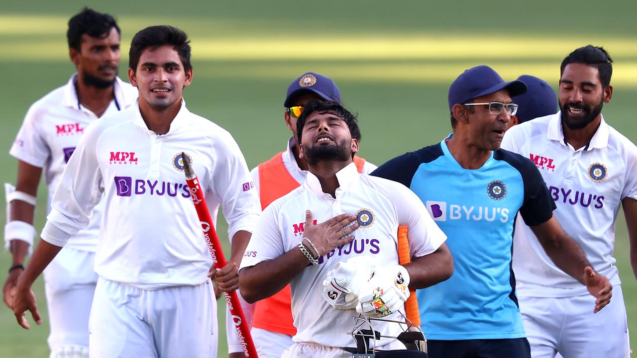 TOPSHOT - India's batsman Rishabh Pant (C) gestures as team celebrate victory in the fourth cricket Test match against Australia at The Gabba in Brisbane on January 19, 2021. (Photo by Patrick HAMILTON / AFP)