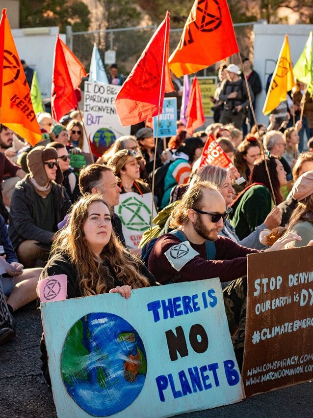 Extinction Rebellion protesters block roads in Brisbane's CBD.