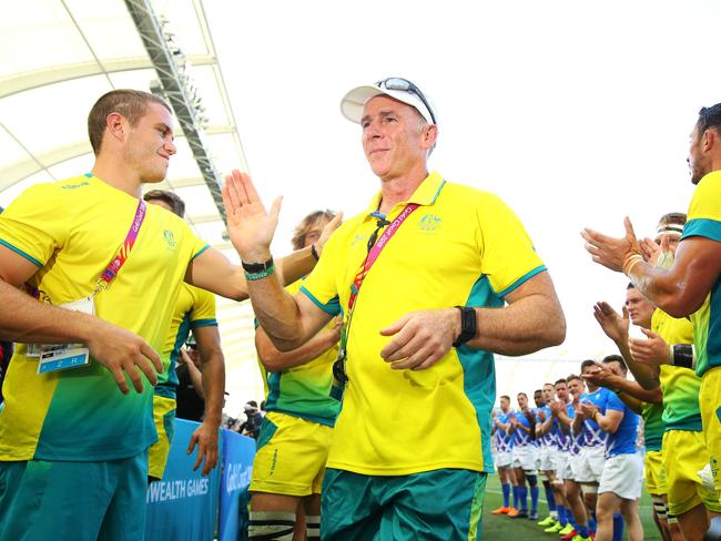 GOLD COAST, QUEENSLAND - APRIL 15:  Retiring Australian coach Andy Friend is applauded from the field by the Australian and Scotland teams after the Rugby Sevens Men Placing 5-6 match between Australia and Scotland on day 11 of the Gold Coast 2018 Commonwealth Games at Robina Stadium on April 15, 2018 on the Gold Coast, Australia.  (Photo by Mark Kolbe/Getty Images)