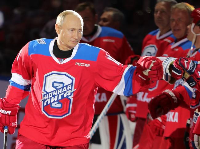 Russian President Vladimir Putin greets Russian hockey players in 2019. Reports suggest he is now “weaker” and “bloated”. Picture: AFP