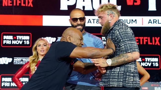 Former US heavyweight boxing champion Mike Tyson and US YouTuber and boxer Jake Paul face off during a press conference in August. Picture: AFP