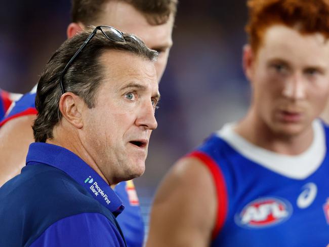 MELBOURNE, AUSTRALIA - MAY 05: Luke Beveridge, Senior Coach of the Bulldogs addresses his players at three quarter time during the 2024 AFL Round 08 match between the Western Bulldogs and the Hawthorn Hawks at Marvel Stadium on May 05, 2024 in Melbourne, Australia. (Photo by Dylan Burns/AFL Photos via Getty Images)