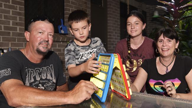 Brendan and Tamara Harris play a game with their children Amarni, 13, and Kodey, 9 at their home in Jabiru.  Picture: Keri Megelus