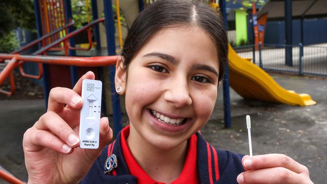 Jells Park Primary School captain Anastasia with a Rapid antigen test kit. Picture: Ian Currie