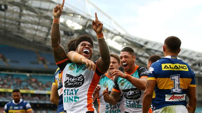 Kevin Naiqama celebrates a try for Wests Tigers against the Parramatta Eels.