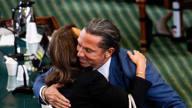 Angela Paxton hugs lawyer Tony Buzbee at the conclusion of her husband Ken’s impeachment trial at the Texas State Capitol on Saturday. Picture: AFP