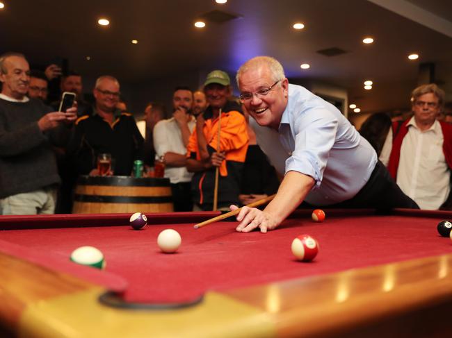 Morrison plays pool at a pub in Launceston and meets and greets the locals. Picture: Adam Taylor