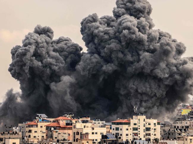 A plume of smoke rises in the sky of Gaza City during an Israeli airstrike. Picture: AFP