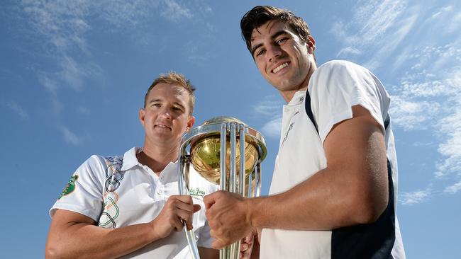 Nathan Hauritz and Pat Cummins with the 2015 ICC Cricket World Cup trophy at Coogee Oval.