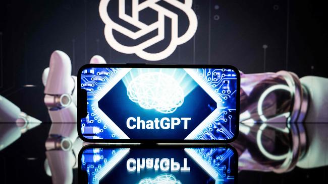 Screens display the logos of ChatGPT