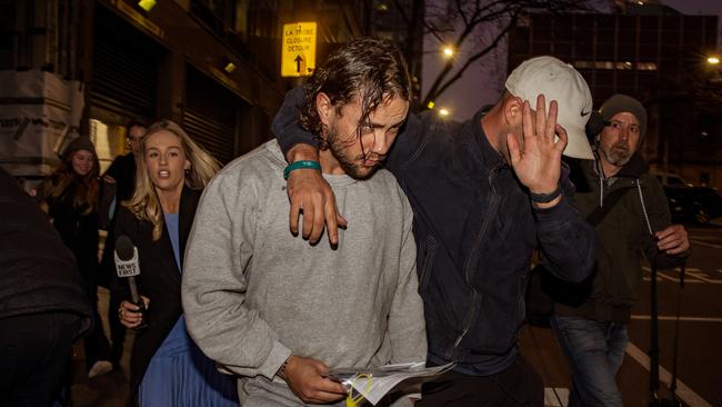 Orpheus Pledger (grey jumper) was pictured leaving court on Wednesday evening. Picture: NewsWire/ Tamati Smith