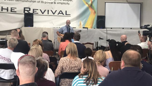 The Revival Church pastor Paul Furlong sings to parishioners during a service in Narre Warren in breach of lockdown restrictions on Sunday. Picture: Twitter/@tdolling