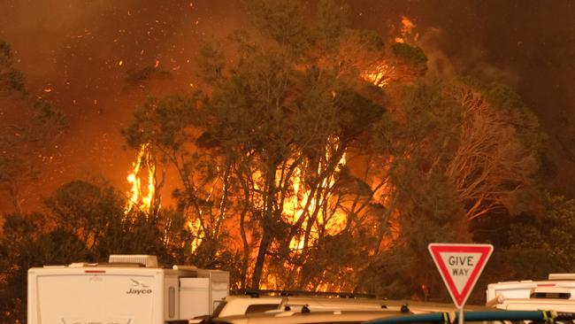 A bushfire in the NSW south coast township of Malua Bay last December. Picture: Alex Coppel