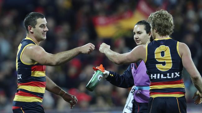 Taylor Walker celebrates a goal with Rory Sloane. Picture SARAH REED