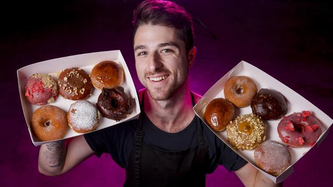 Anthony Randello-Jahn with some Levain doughnuts. Picture: Wayne Taylor.