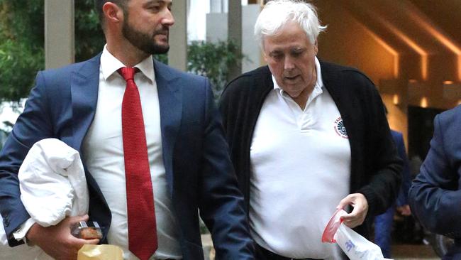 Clive Palmer holds sick bag arrives at court after the lunch break lunch.