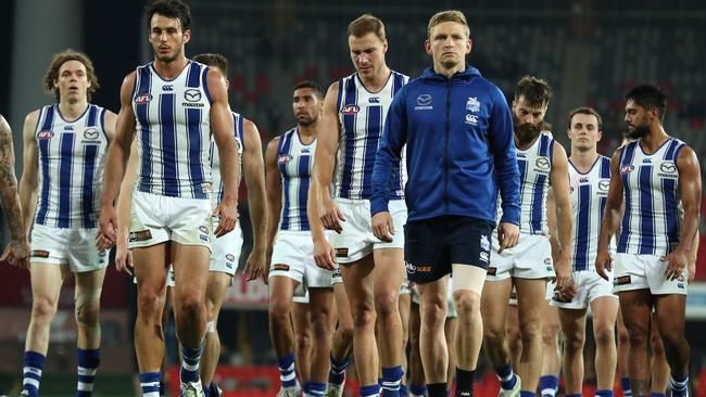 Kangaroos skipper Jack Ziebell leads his team off Metricon Stadium after losing to Richmond Picture: Michael Klein