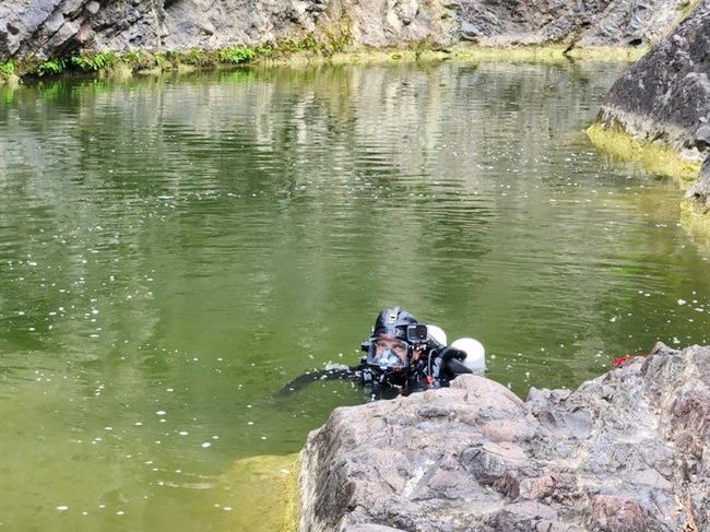 Police divers search Kinbombi Falls, west of Gympie and about 10 minutes from Goomeri, looking for missing man Jack McLennan this week.