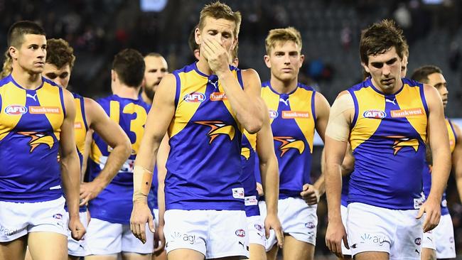 The Eagles look dejected after losing the round 20 AFL match between the St Kilda Saints and the West Coast Eagles at Etihad Stadium.