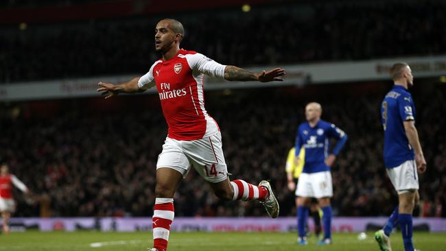 Arsenal's English midfielder Theo Walcott (C) celebrates.