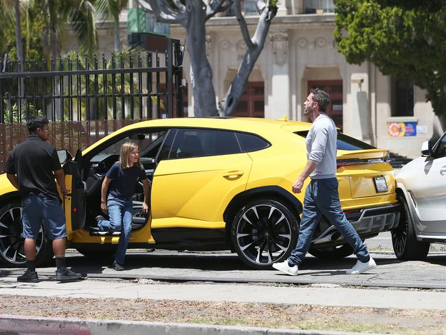 Samuel Garner Affleck seen leaving the driver’s side seat of the Lamborghini Urus, as Ben Affleck, far right, inspected the damage. Picture: X17online.com