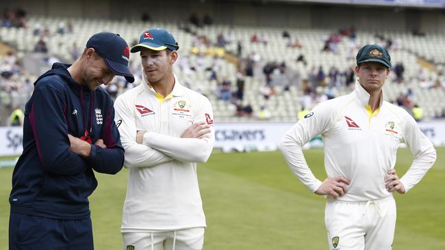 England captain Joe Root (left) chats to his Australian counterpart Tim Paine as First Test man of the match Steve Smith (right) watches on at Edgbaston. Picture: Getty Images