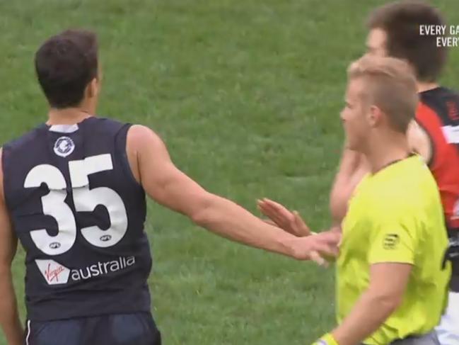 AFL screen shot of Ed Curnow touching an umpire.