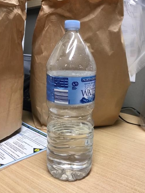 Drugs in a liquid form allegedly found in a plastic water bottle. Picture: supplied