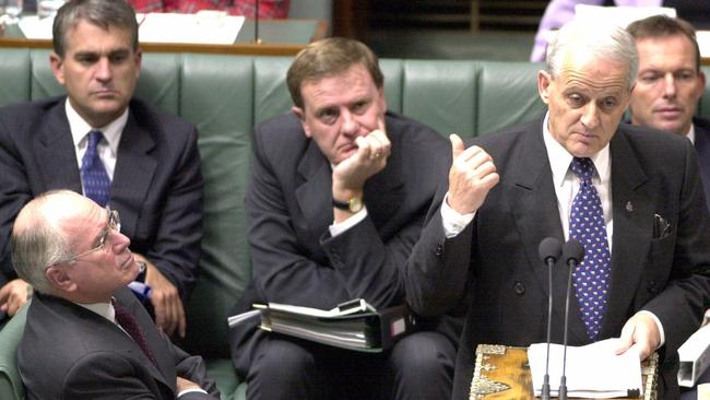 John Howard (bottom left), Peter Costello (centre) and Tony Abbott (far right) listen to Philip Ruddock speak during Question Time in 2002. Picture: File