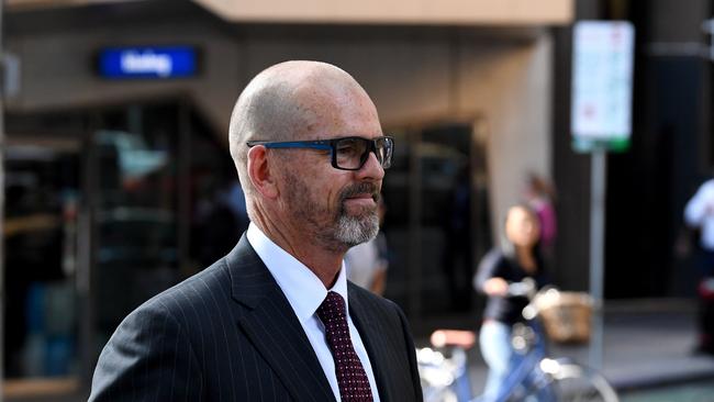 Former Victoria Police Chief Commissioner Simon Overland departs the Royal Commission into the Management of Police Informants at the Fair Work Commission in Melbourne, Tuesday, January 21, 2020. (AAP Image/James Ross)