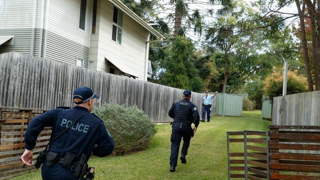 Police from Operation Amarok High-Risk Domestic Violence team react after noticing a heated argument unfolding next door to an address where they were hoping to arrest a different high risk offender in West Kempsey. Picture: Max Mason-Hubers