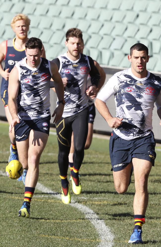 Adelaide captain Taylor Walker, right, and Mitch McGovern, left, run laps at training earlier in the year. Picture: Sarah Reed